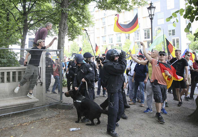 германия, протесты, мигранты