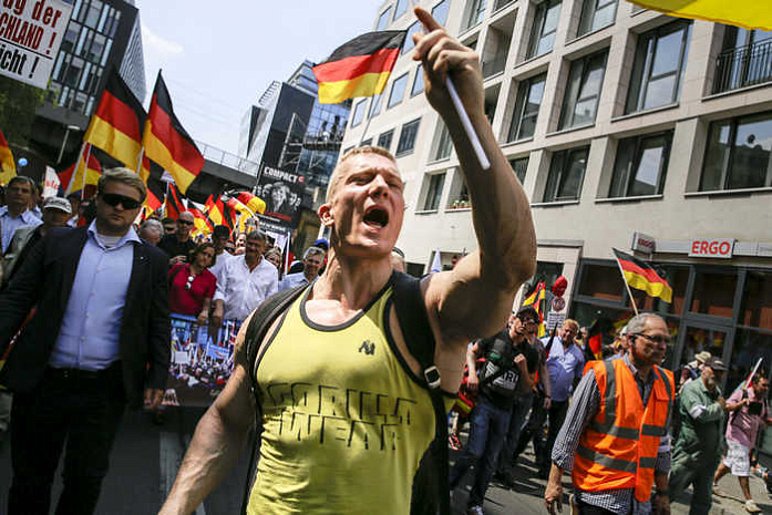 германия, протесты, мигранты
